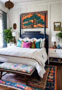 a bedroom with white bedding and colorful pillows