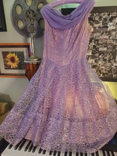 Vintage 1950's Purple and Silver Lace Prom Dress! Tea Length. Sleeveless. Zips up the back. Beautiful Chiffon Train in the back. This dress has been in many dance numbers. A few tears in the lace that seem to have been mended along the way. Please check photos. This dress was last seen on stage in West Side Story! Please check measurements carefully as I don't accept returns at this time. Chest:38" Waist: 31" Length Shoulder to Hem: 43" Lace Purple Dress, Prom Dress Tea Length, Dress Tea Length, Color Clothes, Purple And Silver, West Side Story, Lace Prom Dress, Razzle Dazzle, Silver Lace