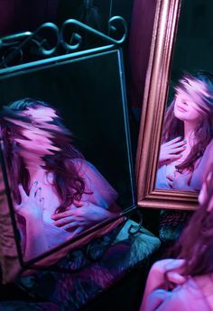 a reflection of a woman in a mirror