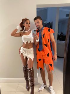 a man and woman dressed up in costumes