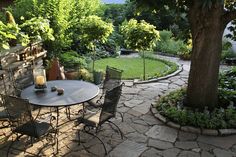 an outdoor patio with table and chairs