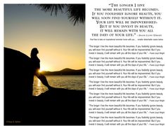 a woman sitting on top of a rock next to the ocean with a sunset in the background