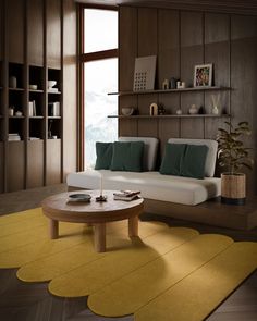 a living room filled with furniture and a yellow rug on top of a hard wood floor