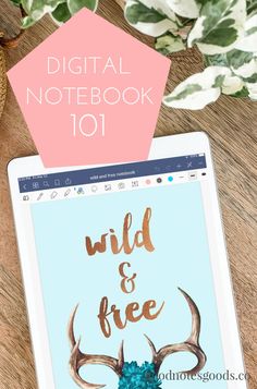 a tablet with the words wild and free on it next to a plant that reads digital notebook 101