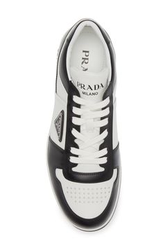 Contrast trim zips around the low-profile silhouette of a sleek leather sneaker featuring a perforated toe and three versions of the iconic Prada logo. Lace-up style Leather upper/textile lining/synthetic sole Imported Designer Shoes Designer High-top Sneakers With Logo Detail, Designer High-top Sneakers With Logo, Luxury High-top Sneakers With Perforated Toe Box, Designer Calf Leather Sneakers With Perforations, Luxury Calf Leather Sneakers With Perforations, Luxury Perforated Calf Leather Sneakers, Luxury Leather High-top Sneakers With Perforations, Designer Leather High-top Sneakers With Perforated Toe Box, Designer Leather High-top Sneakers With Perforations