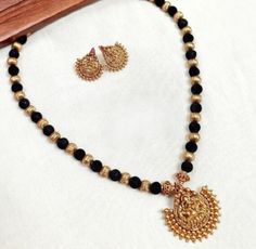 Explore traditional temple jewellery . This Black Thread Kemp Stone Lakshmi Necklace Set with A1 quality and micro finishing.    ✅ This necklace is handcrafted by Great Indian artists ( support local artists) ✅ colour & style perfect to go with all your outfits. ✅ Comes with Premium Quality Polishing. Black Thread Gold Jewellery, Black Thread Jewellery Indian, Lakshmi Pendant, Simple Chain, Support Local Artists, Thread Jewellery, Black Thread, Gold Jewelry Indian, Crystal Chain