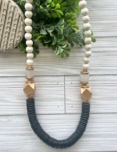 Black and white statement necklace, Black and white wood beaded Necklace, African Recycled glass beads, Handmade beaded necklace.  A great neutral black, white, and gold statement necklace. This is shown in the 30 inch length, but I can make it in any custom length, including 26 inch and 22 inch. Just message me for a custom style!  Each piece is custom made. It will look very similar, but due to the nature of natural products, it might sightly vary! The 30 inch style can be made with no clasp a White Wooden Beaded Necklaces, Everyday White Necklaces With Wooden Beads, White Wooden Beads Necklace, Statement Necklace Black, Black Necklace Statement, Necklace African, Handmade Beaded Necklace, Black White And Gold, Recycled Glass Bead