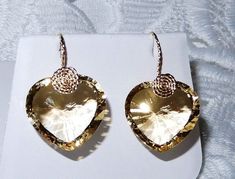 VERY RARE CUT, 49.07CTS NATURAL UNTREATED HEART CONCAVE CUT LEMON QUARTZ GEMSTONES, 14KT YELLOW GOLD HOOK PIERCED EARRINGS Each stone weighs approx. 24+cts. Measurements with hooks 1 1/8 inches long x 7/8 inch wide. Earrings come in an earring box & outer 2pc gift box. I will include a pair of clear rubber sleeves for the hooks, so you won't be in fear of losing the earrings while wearing them. I CAN CHANGE THE GOLD HOOK OUT FOR ANOTHER FINDING, PLEASE CONTACT ME BEFORE PURCHASE. STONE DETAILS S Luxury Gold Heart Earrings For Wedding, Pierced Heart Cut Earrings For Formal Occasions, Formal Yellow Gold Heart Cut Earrings, Elegant Gemstone Heart Earrings For Formal Occasions, Elegant Formal Heart Gemstone Earrings, Gold Heart Cut Earrings For Formal Events, Gold Heart Cut Earrings For Formal Occasions, Formal Yellow Gold Pierced Heart Earrings, Formal Yellow Gold Heart Earrings