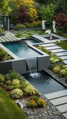 an outdoor garden with a waterfall and water feature