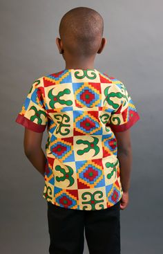 This short sleeved African Kente shirt is real cute. Dress him up in this cute African outfit and he will attract a lot of attention and draw tons of compliments. He can wear it whenever he wants to project his African Identity. He can wear it during Sankofa, Kwanzaa, and any African American or Afrocentric Cultural event. *Hand Sewn African Dress *Made by Local Artisans in Africa *100% Cotton *Made in Ghana *Portions of proceeds donated to charities in Africa *Everything in stock is available i Ankara Shirt, African Shirt, Dashiki Shirt, African Shirts, Boy Shirt, Kwanzaa, Donate To Charity, African Men, Cultural Events