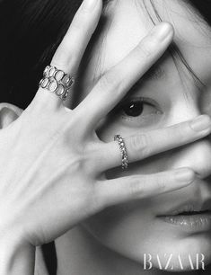 black and white photograph of a woman holding her hands up to her face with the word harper written on it