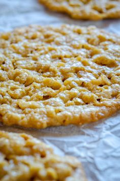 some cookies are sitting on top of wax paper