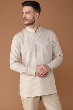 Yell's signature linen kurta returns! This time, in earthy natural tones with blue jali stitch adding the perfect element of surprise. Blue contrast inside collar and pocket adds a new dimension to this 100% linen kurta. Paper Cotton Kurta For Men, Linen Shirt Designs Men, Pola Kurta Lelaki, Khadi Dresses Indian, Kurta Neck Design Men, Traditional Long Sleeve Linen Kurta, Casual Long Sleeve Beige Kurta, Casual Beige Long Sleeve Kurta, Beige Long Sleeve Casual Kurta