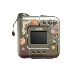 a digital camera with stickers on it