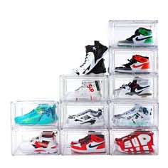 six clear acrylic shoe storage bins filled with various pairs of nike shoes