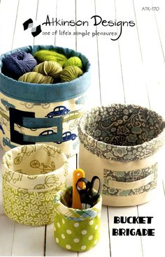 three different types of storage containers with scissors and yarn in them