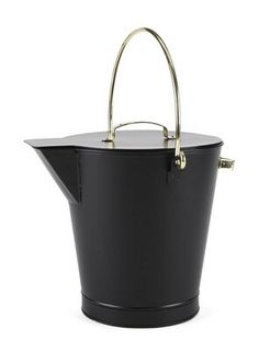 a black and gold bucket with handle on the side, sitting against a white background