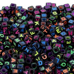 the letters are made up of different colors and sizes, including black one with multi - colored letters