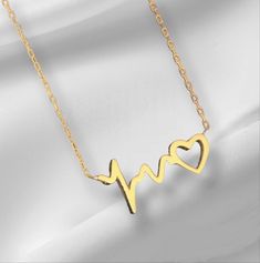 10K 14K 18K Gold Heart Rhythm Necklace, Gold Heart Necklace, ECG Sound Wave Necklace. Handmade Heart Necklace, Christmas Gift, Mother's Day Gift. All jewelry in our collection are real solid gold and completely handmade accessories. The jewelry in our collection, which is an accessory with a bright and eye-catching beauty that will make others notice you and your loved ones in the environments you enter, is a great gift option to add value to the people you care about on special occasions. * Han Yellow Gold Clavicle Necklace For Valentine's Day, Gold Plated Jewelry For Valentine's Day Anniversary, Valentine's Day Yellow Gold Clavicle Necklace, Valentine's Day Anniversary Gift Gold Plated Jewelry, 14k Gold Clavicle Chain Necklace For Valentine's Day, Yellow Gold Clavicle Chain For Valentine's Day, 14k Gold Heart Pendant Necklace For Gift, Yellow Gold Clavicle Chain Jewelry For Valentine's Day, 14k Gold Open Heart Necklace For Gift