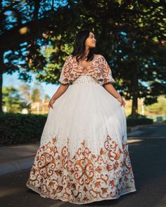 This Habesha dress is made of luxurious Menen fabric, known for its softness and durability. The dress features a gorgeous pattern of intricate Tilf embroidery, covering the entire dress from the neckline to the bottom. The Tilf embroidery adds a touch of elegance and sophistication to the dress, featuring delicate patterns and designs that are unique to Ethiopian traditional clothing. The dress is designed with a fitted bodice that accentuates the waistline and flares out into a flowing skirt, Habesha Kemis Modern, Dresses For Baby Shower, Ethiopian Hair, Ethiopian Dresses, Habesha Wedding, Eritrean Dress, Habesha Dress, Ethiopian Traditional Dress, Ethiopian Dress