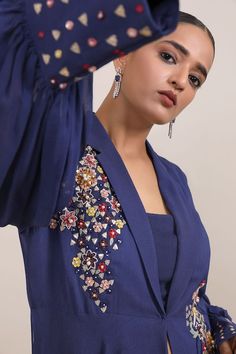 Navy blue high low jacket with sequin applique, cutdana, bead embroidery in floral pattern. Paired with inner and palazzo. - Aza Fashions Festive Long Sleeve Blue Blazer, Festive Blue Long Sleeve Blazer, Elegant Blue Embroidered Outerwear, Blue Nehru Jacket For Fall With Long Sleeves, Blue Long Sleeve Sets With Set-in Sleeves, Elegant Long Sleeve Blue Nehru Jacket, Palazzo Set, Sequin Appliques, Embroidered Jacket