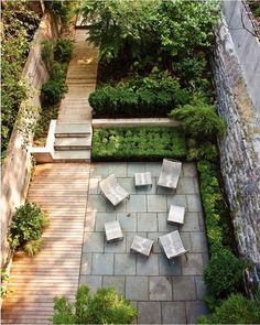 an aerial view of a patio and seating area with trees in the backgroud