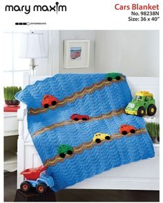 a crocheted blanket with cars on it