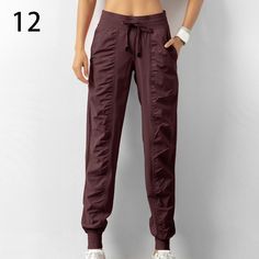 Look stylish and stay comfortable with these Women's Drawstring Workout Pants with Pockets. Crafted from a polyester blended material, these pants feature a pleated design, medium stretch, and a loose fit for maximum comfort. Choose from 7 different colors to find the perfect fit for you. These pants are perfect for any season and any occasion. With a high waist and straight pant style, you'll look great and feel great. The drawstring and pockets add a stylish touch to the pants, making them per Solid Color Drawstring Yoga Pants, Solid Color Yoga Pants With Drawstring, Yoga Pants With Drawstring, Casual Solid Color Nylon Yoga Pants, Casual Solid Nylon Yoga Pants, Solid Nylon Joggers With Elastic Waistband, Stretch Solid Color Cargo Pants With Elastic Waistband, Stretch Fit Solid Cargo Pants With Elastic Waistband, Aesthetic Outfits Sweatpants