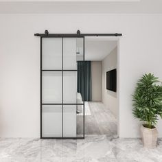 an empty room with white walls and marble flooring is seen through the glass doors