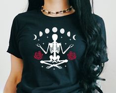 ♥ Hello and Welcome to Meaningful Tees Shop! ♥ Be ready for Halloween with this Unique Goth Skeleton Tee with deep red roses, stars, and distressed Moon Phases! ♥ Printed on the Premium Bella Canvas 100% Cotton Unisex Tshirt, this Comfy high quality Tee is sure to be a hit on Halloween! ♥ All of our items are made to order with care for each customer : ) ♥ Please allow 3-5 BUSINESS days for your item to be created PLUS shipping time via USPS ♥ This Unisex Tee fits like a Men's Shirt on Women, bu Edgy Clothes, Goth Skeleton, Clothing Grunge, Emo Clothing, Aesthetic Emo, Goth Clothes, Gothic Shirts, Goth Clothing, Alt Style