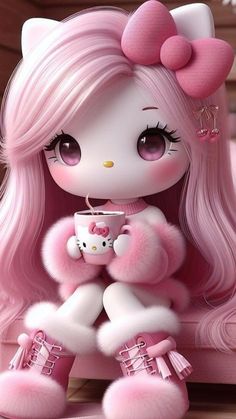 a pink kitty doll sitting on top of a bed holding a coffee cup in her hand