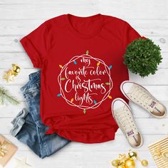 "My favorite Color is Christmas Lights, Christmas T-Shirt, Christmas Tshirt, Christmas Lights Shirt, Winter Time Shirt, Christmas Gift Shirt Hi!  Welcome. It's great to see you here! ☺️ Our shirts are clean, high quality and soft. It is prepared quickly by our boutique.  Ironing and shipped.  Enjoy your shopping! It is a pleasure for us to help you with your questions and you can reach us at any time. Please, don't forget to check our size cards. HOW TO ORDER SHIRT 👕 Please, choose your favorit My Favorite Color Is Christmas Lights Shirt, Christmas Holiday T-shirt With Letter Print, Christmas Holiday Letter Print T-shirt, Red Christmas Tops With Letter Print, Festive Crew Neck T-shirt With Letter Print, Festive Letter Print Crew Neck T-shirt, New Year Red T-shirt With Graphic Print, Red Graphic Print T-shirt For New Year, Red Graphic Tee For Christmas