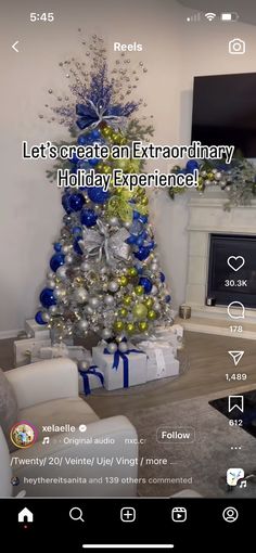 the christmas tree is decorated with blue and silver ornaments