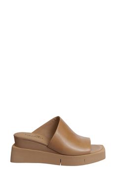 A soft leather slide sandal offers sophisticated style with an architectural vamp lifted by a wedge heel. 2" heel; 1/2" platform Leather upper/synthetic lining and sole Imported Leather Slide Sandals, Leather Slides, Sandal Women, Sophisticated Style, Slide Sandals, Wedge Heels, Soft Leather, Womens Sandals, Camel