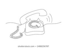 an old fashioned phone with a cord attached to it