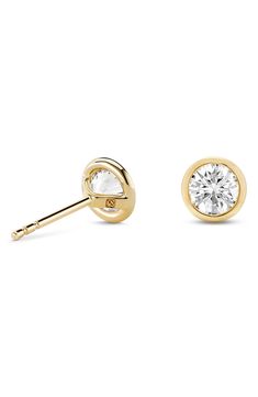 Lab-grown diamonds are bezel set in 14-karat gold in these gorgeous stud earrings that'll effortlessly elevate any ensemble. 1/4" diameter   Total lab-grown-diamond weight: 1.0ct.   Color: G–J   Clarity: VS   14k gold/lab-grown diamond   Imported   >Diamond Guide Gold Diamond Earrings With Tension Setting, Classic Gold Diamond Earrings With Tension Setting, Elegant Yellow Gold Diamond Earrings With Tension Setting, Classic Yellow Gold Earrings With Bezel Setting, 14k Gold Tension Setting Earrings For Anniversary, Gold Round Cut Diamond Earrings With Bezel Setting, 14k Gold Earrings With Tension Setting For Anniversary, Elegant Gold Diamond Earrings With Tension Setting, Timeless Yellow Gold Earrings With Bezel Setting