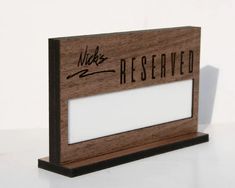 a wooden plaque with the words reserved on it