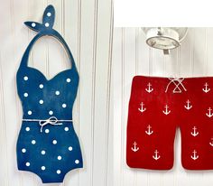 two wooden pieces with white and blue designs on them, one is made to look like a bathing suit