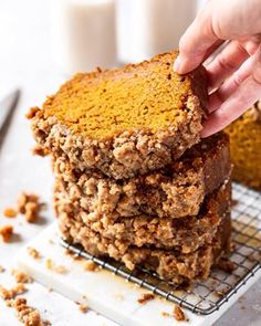 a stack of pumpkin spiced oatmeal breakfast bars on a cooling rack