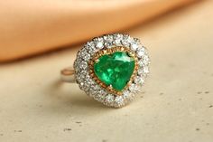 *Condition: Brand new *Center Stone: Natural Emerald from Colombia, Heart Cut approx 3.1ct (IF Color, 5A Color) *Side Stone: Natural White Diamond, round cut (VS1 clarity and F color) *Gold Weight: 4.76g *Ring and pendent two in one Each piece is made-to-order with care and special attention to detail. all items are made with conflict-free diamonds and gems. Size: made to order The item will be gift wrapped and shipped. --------------------------------------------------------- Available in : 14k Engagement Ring Emerald, Handmade Gold Ring, Traditional Engagement Rings, Pendant Ring, Ring Emerald, Emerald Pendant, Emerald Engagement, Emerald Engagement Ring, Pendant Rings