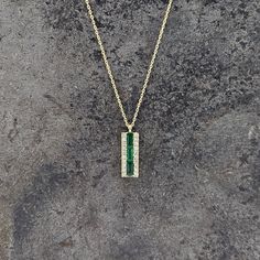 Discover the beauty and elegance of our Emerald and Diamond Necklace. Made with 14k yellow gold, this necklace features stunning emeralds and 0.10ct diamond, adding a touch of luxury to any outfit. The 16-18" chain is secured with a spring ring clasp for ease and comfort. Elevate your style with this timeless piece. Emerald And Diamond Necklace, Sterling Silver Jewelry Earrings, Charm Rings, Chains For Men, Birthstone Jewelry, Ring Bracelet, Spring Rings, Gold Bands, Timeless Pieces