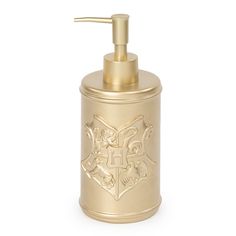 a gold soap dispenser on a white background