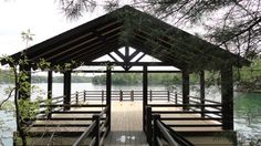 a wooden dock sitting on top of a lake