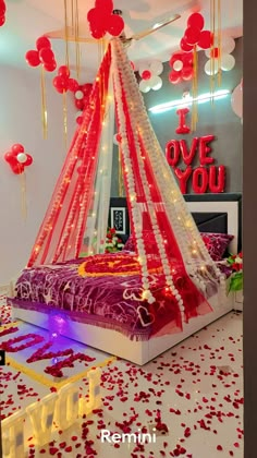 a bed decorated with red and white decorations for valentine's day or other special occasion