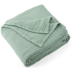 a green blanket folded on top of each other