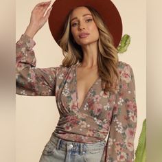 Adorable Bodysuit With A Pink Floral Pattern And Deep Plunge Neckline. Long Sleeve And Full Back Coverage. Deep Plunge Bodysuit, Spring Multicolor V-neck Bodysuit, Fitted V-neck Printed Bodysuit, Pink Floral Print One-piece Bodysuit, Fitted V-neck Floral Print Bodysuit, Stretch Ruffled V-neck Bodysuit, Bustier Bodysuit, Brown Bodysuit, Plunge Bodysuit