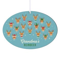 an oval ornament with reindeer heads and hats on it's face, says grandma's reindeer