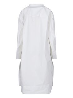 Khaite 'Brom' white cotton maxi dress with V-neck, button detail, two side pockets, side slits, straight hem. Composition: 100% Cotton Long White Cotton Shirt Dress, White Dress With Side Pockets, White Dresses With Side Pockets, Oversized White Dress With Pockets, Oversized White Midi Dress For Daywear, White Long Shirt Dress For Work, White Maxi Length Shirt Dress For Daywear, White Long Dress For Work, Long White Dress For Work