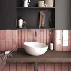 a white bowl sink sitting on top of a wooden counter