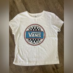 Nwot! Only Flaw Is Foundation On The Inside Of The Neckline From Trying On. Has Not Been Washed. White Cotton Vans T-shirt, Vans Graphic Tee With Logo Print, White Vans T-shirt With Graphic Print, Vans White T-shirt With Graphic Print, Vans Cotton Graphic Tee Tops, Blue Cotton Vans Top, Blue Cotton Vans Tops, Vans Blue Short Sleeve Tops, White Vans T-shirt For Summer